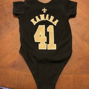 Saints Kamara onesie